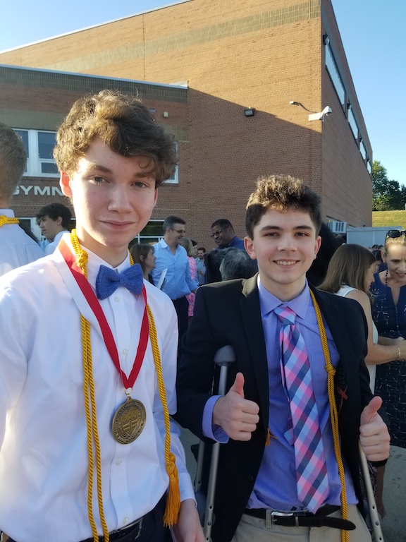 Two students at high school academic awards ceremony.